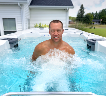 Man walking against the swim spa propulsion.