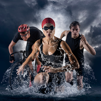 Triathletes running and biking.