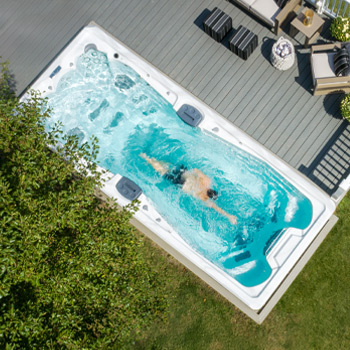 Drone view of a swimmer in an H2X Fitness Swim Spa.