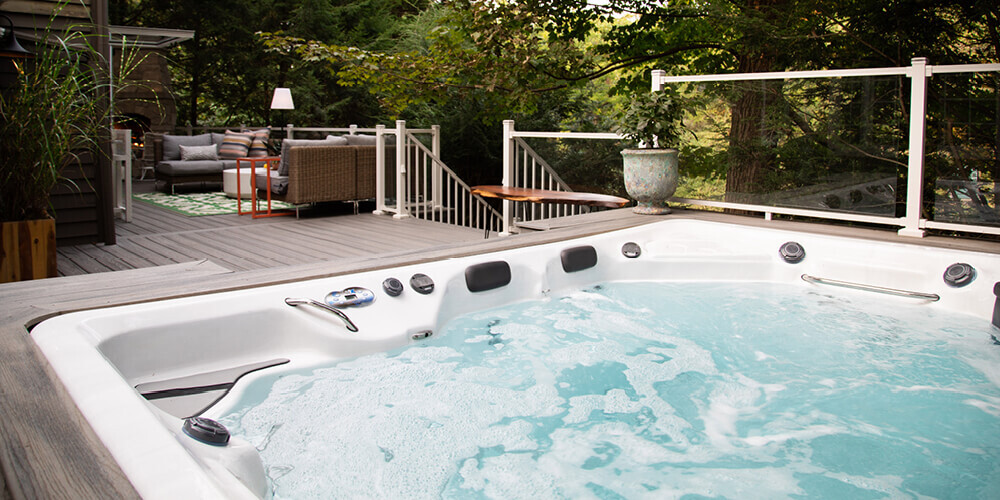 Picture close to the water and showing the control panel on a swim spa.