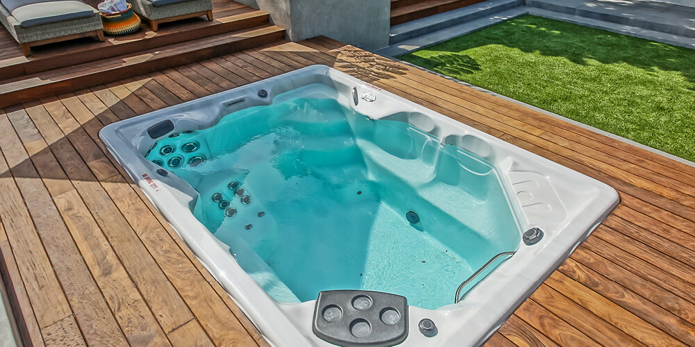 H2X Therapool D swim spa set into a deck.